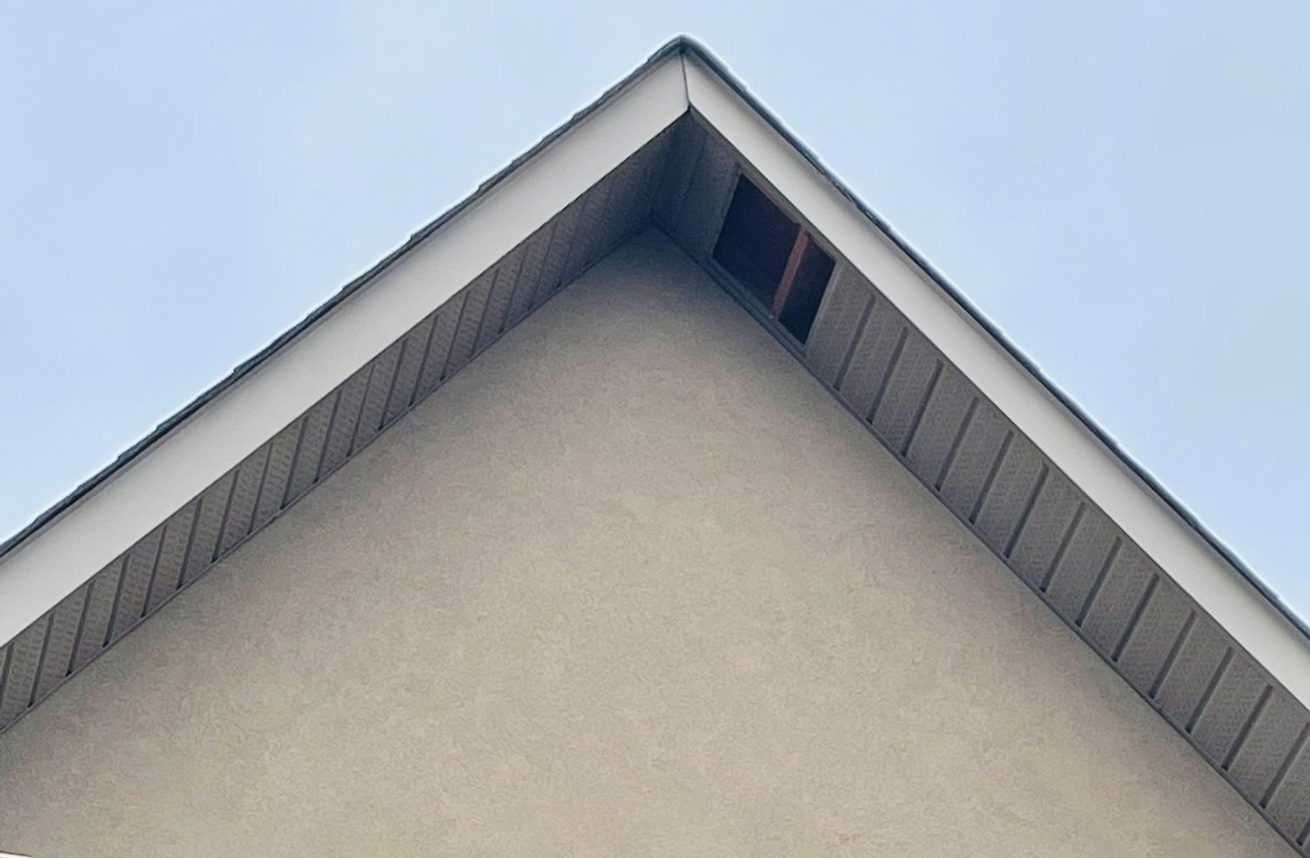 House roof with missing soffit